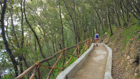 Woman-Hiker-Walking-In-Beautiful-Nature-Path-During-Summer-In-Capri-Island,-Italy---wide