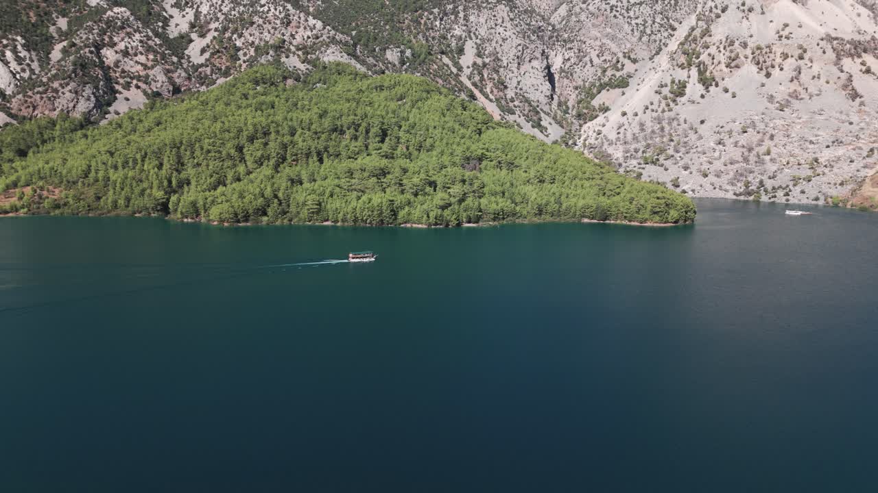 Idyllic View Of A Boat Sailing Across Green Canyon Of Oymapinar Dam Reservoir In Antalya Province, Turkey