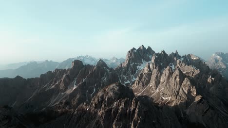 beautiful aerial alpine mountain top range landscape, dramatic steep scenery, hyperlapse