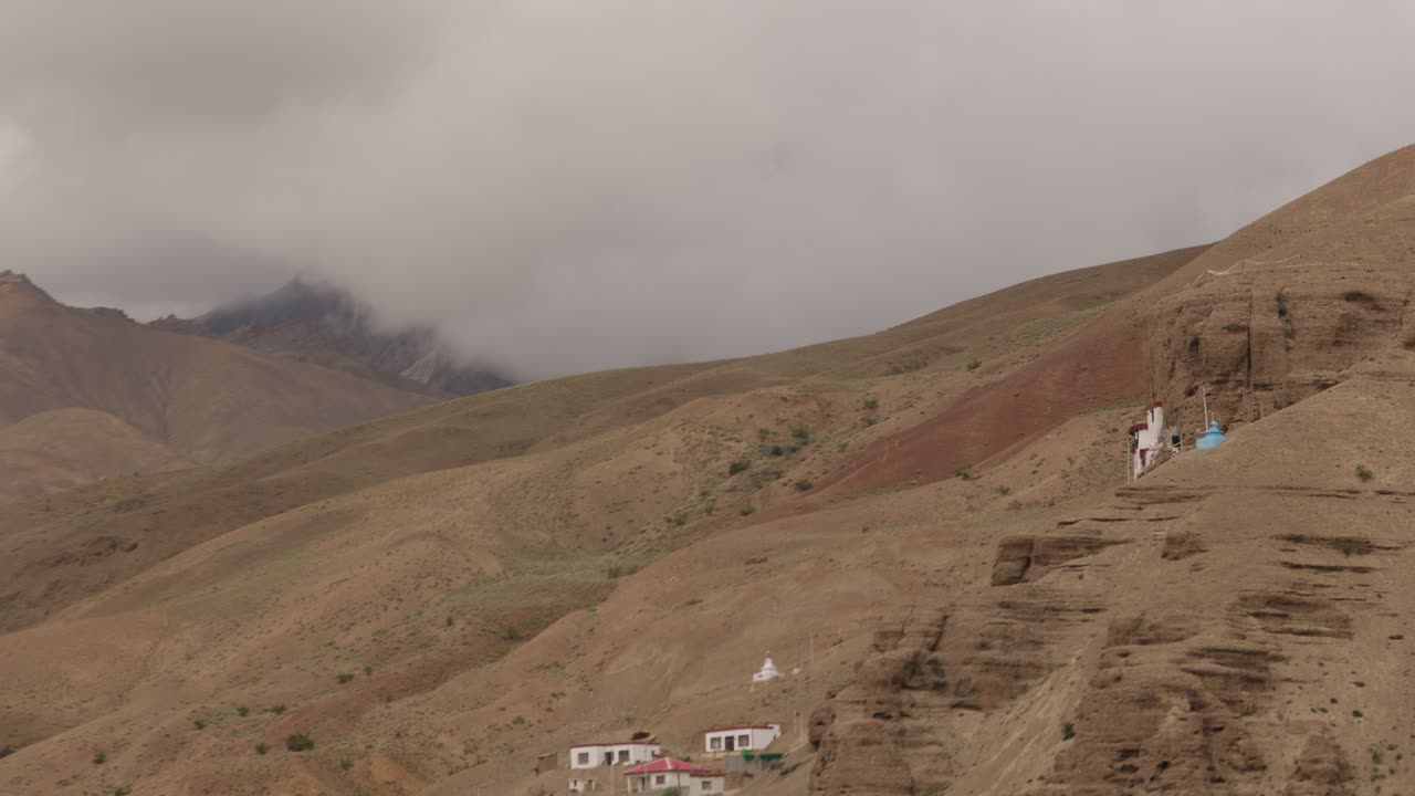 Gompa build on cliff face in Mulbekh in mountainous landscape, the most western Buddhist settlement in Ladakh