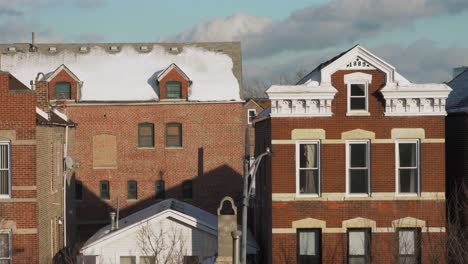 medium shot of brick homes in chicago at the end of winter on clear day