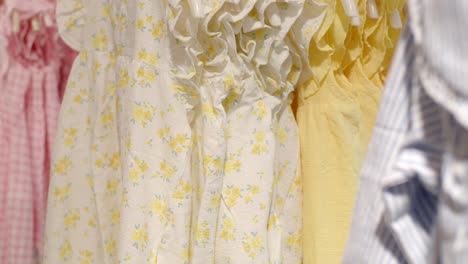 colorful children's dresses on display