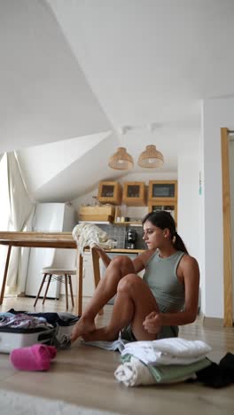 woman packing suitcase