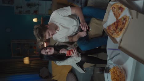 friends enjoying pizza and drinks at home