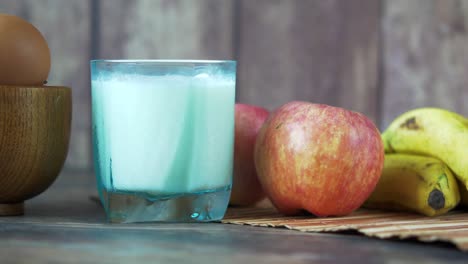 healthy breakfast with milk, fruits, and eggs