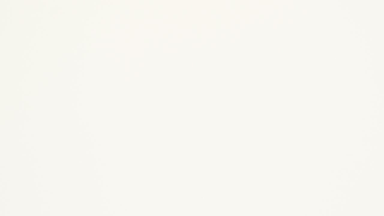 Orange crumpled paper unfolds then refolds on beige in stop motion transition