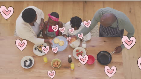 animación de corazones rosados sobre felices abuelos y nietos afroamericanos cocinando en casa