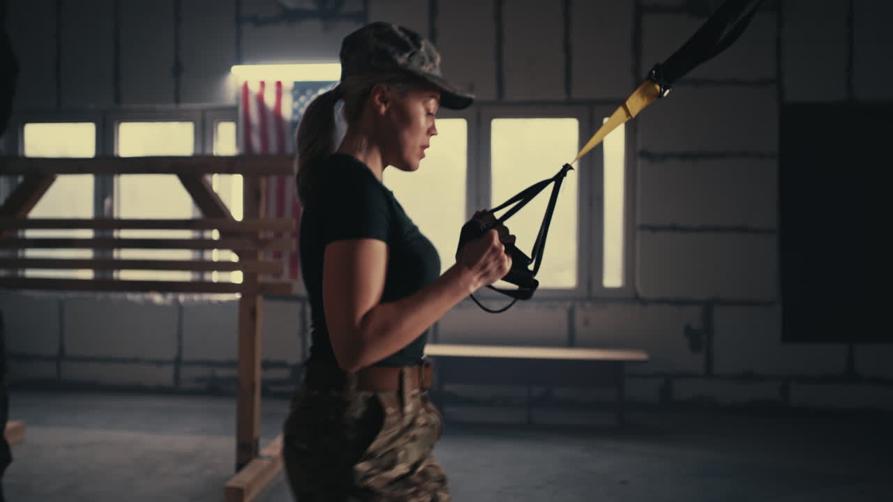 Military Woman Exercising with Resistance Bands