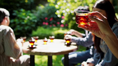friends enjoying tea in a garden