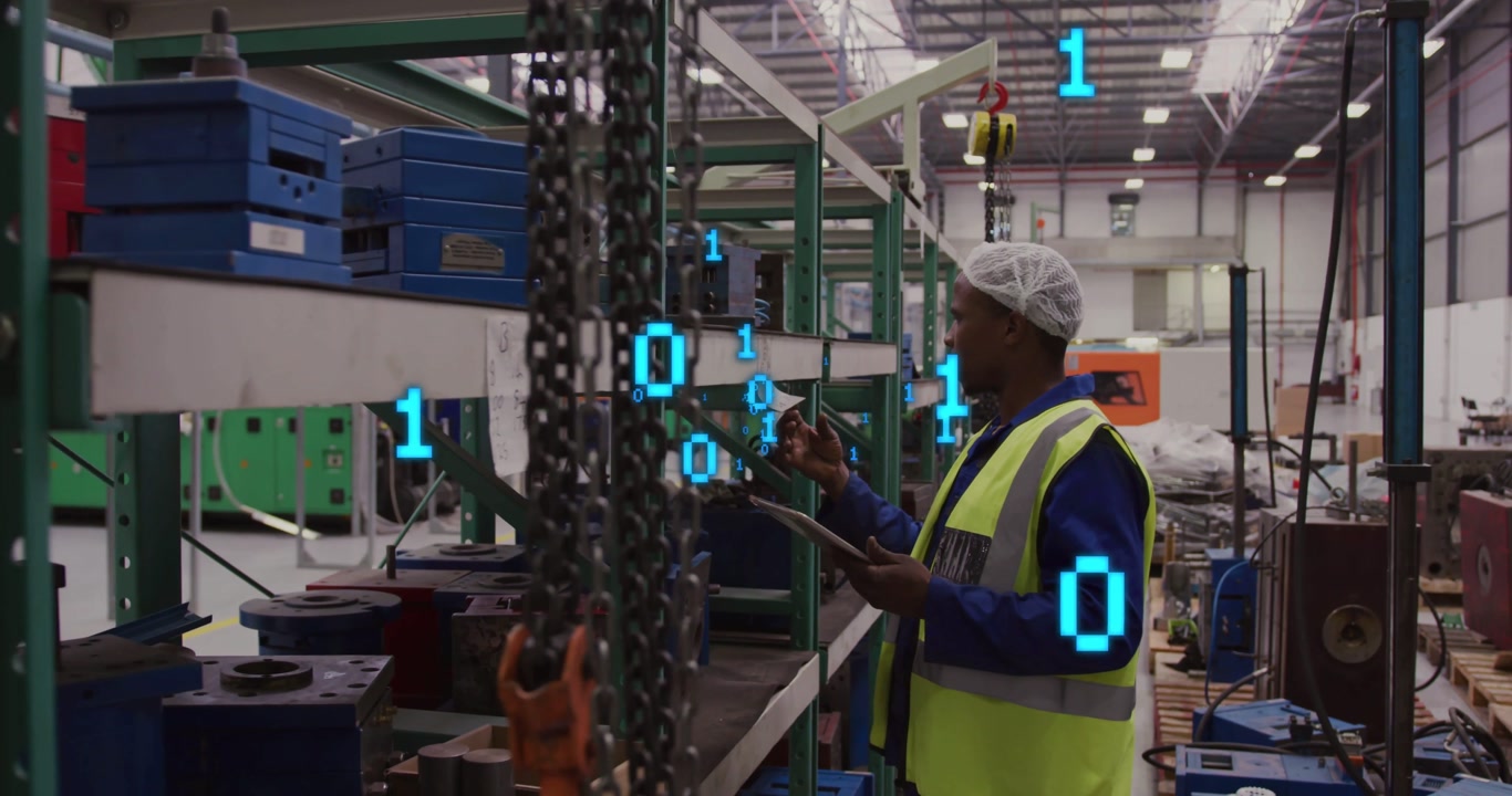 Worker using tablet inspecting hoist and scanning shelves in plant with binary overlay near tablet