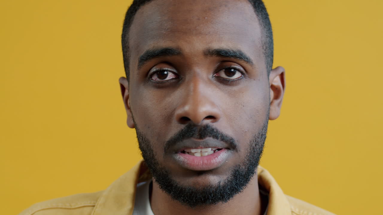 Close-up portrait of a man expressing frustration