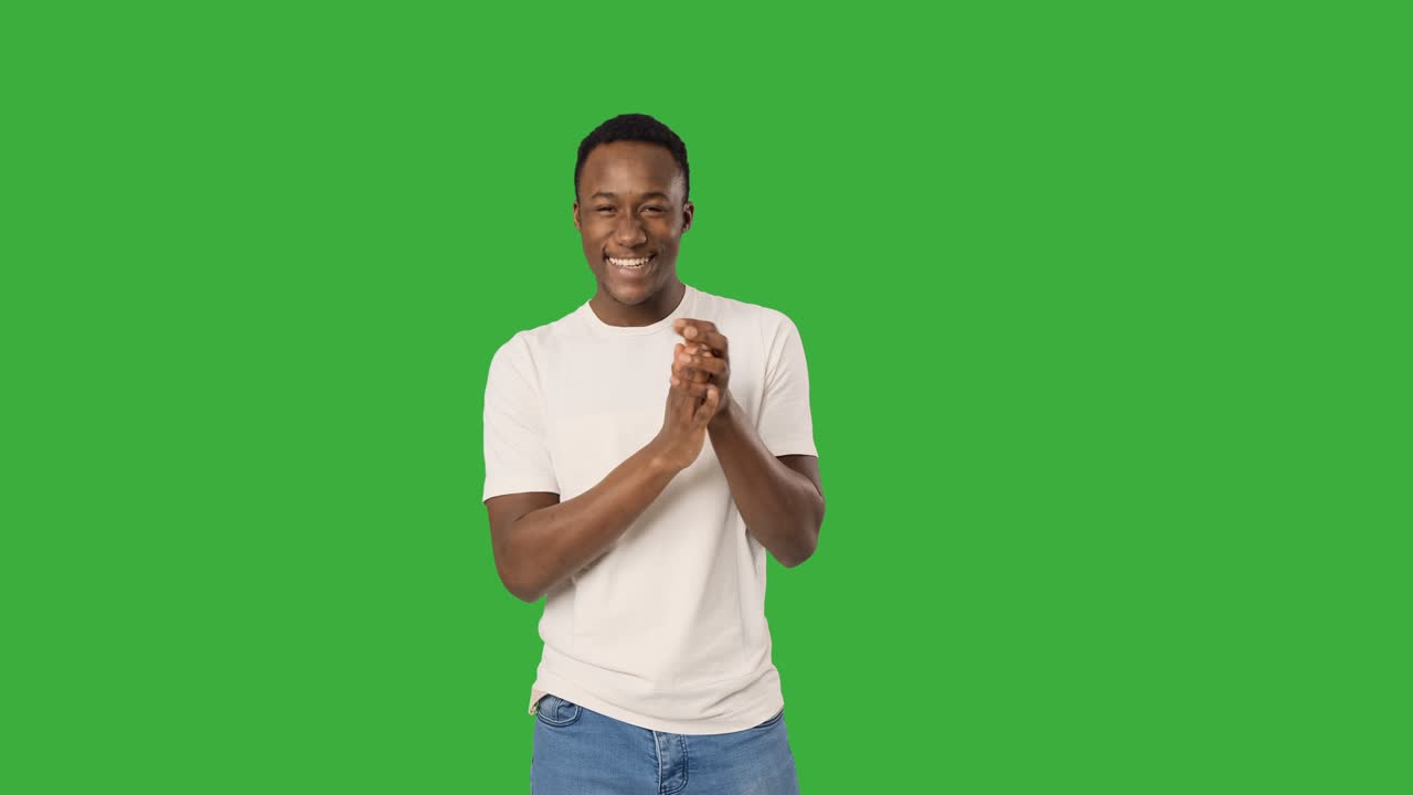 Happy man clapping hands and giving thumbs up gesture