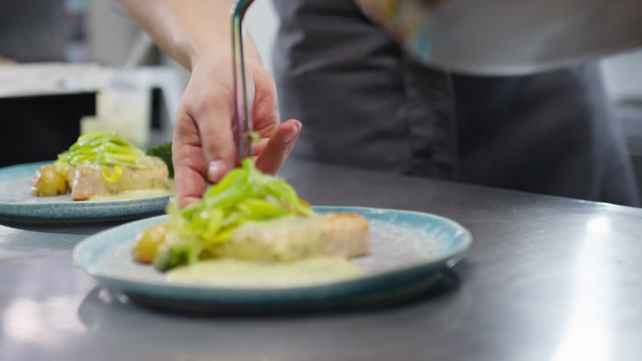Chef Adding Salt and Spices to Dishes