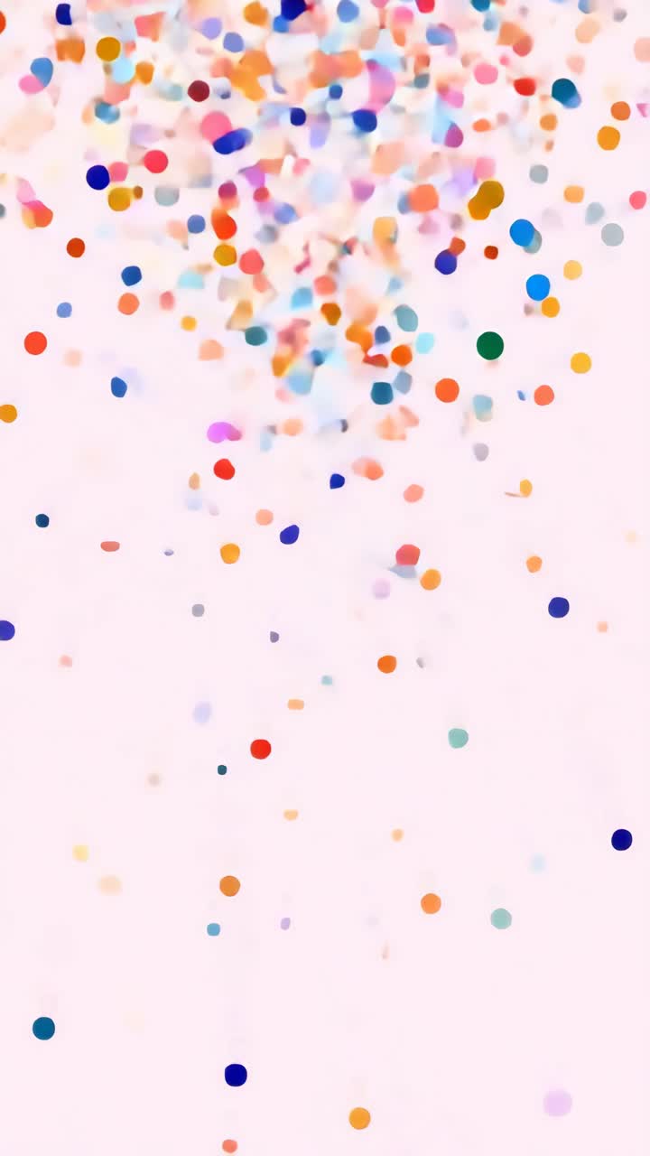 Punti di coriandoli colorati che cadono su uno sfondo chiaro