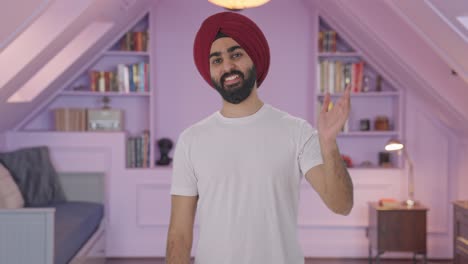 hombre indio sikh feliz diciendo hola