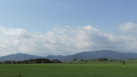 4k timelapse of cute cloud movement above a green land at spain countryside