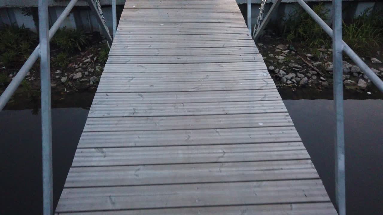 Walking on a pontoon on lake
