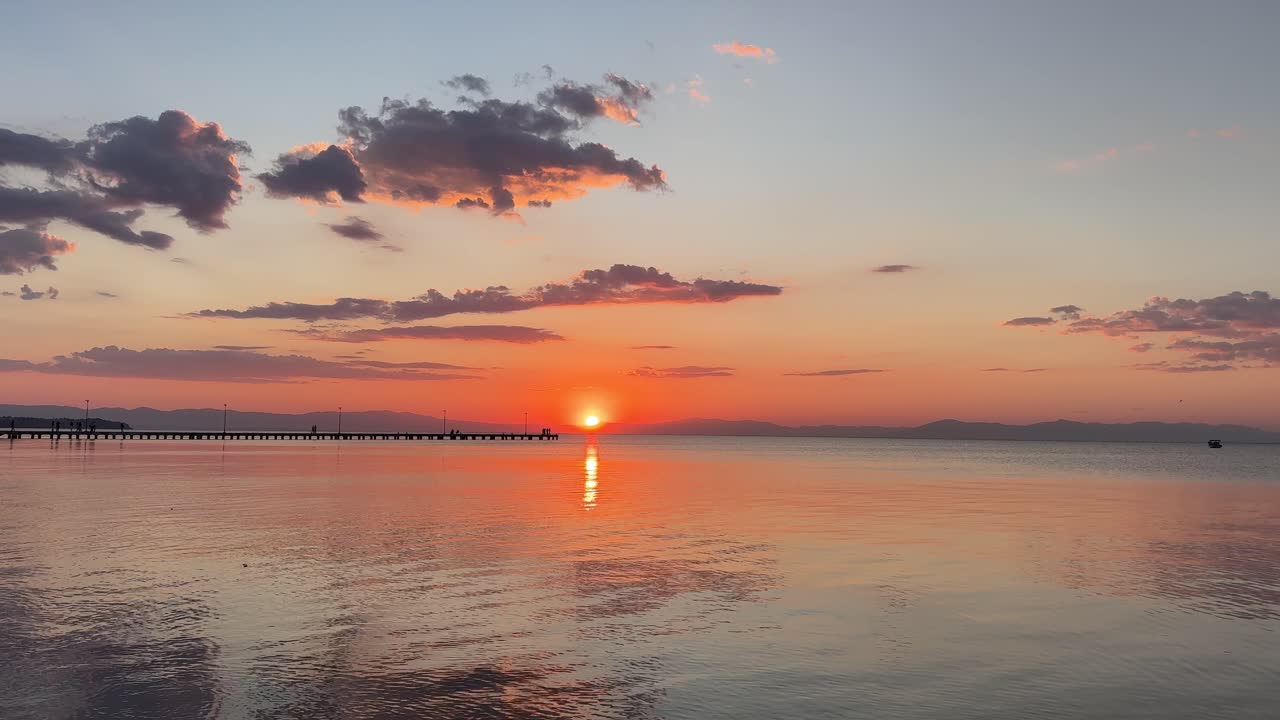 Sunset over Mediterranean sea Greece calm beautiful big orange sun setting
