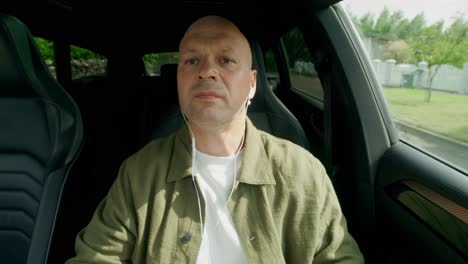 man listening to music while driving