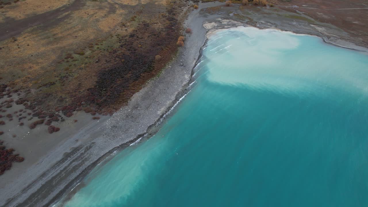Aerial View Of Lake Tekapo With Turquoise Waters And Rugged Terrain In South Island Of New Zealand.