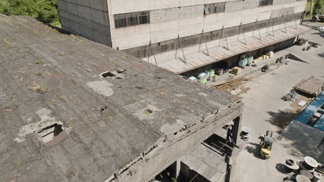 broken concrete roof of industrial warehouse of abandoned factory