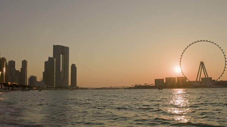 Unsurpassed Sunset Over The Biggest Ferris Wheel In Dubai Marina UAE.