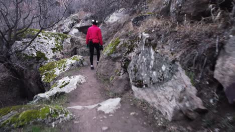 A-Tourist-Walking-Among-The-Rocks-In-The-Ihlara-Valley-In-Cappadocia,-Turkey