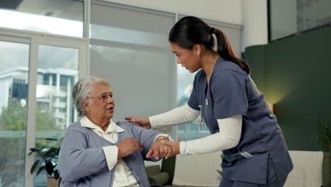 nurse assisting elderly woman at home