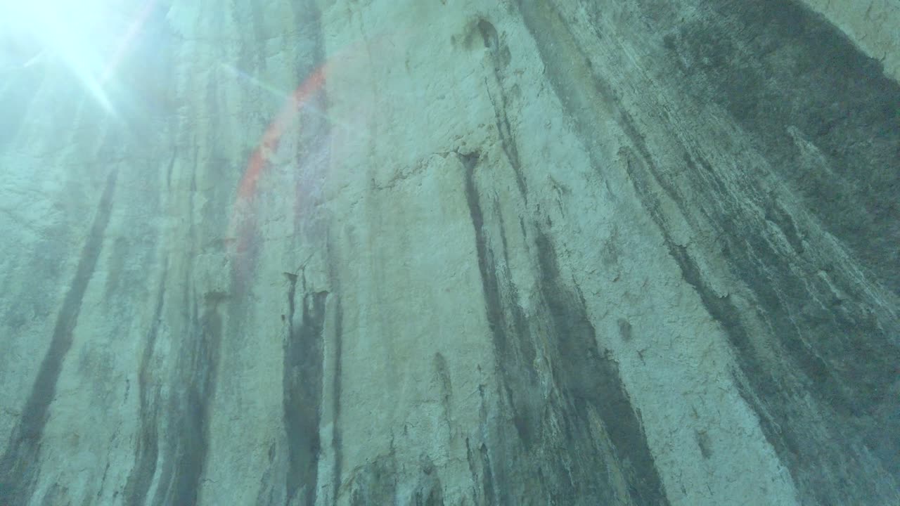 Explore the rugged beauty of Marmitte dei Giganti near Torbole, featuring rocky terrain, lush greenery, and stunning natural formations, perfect for hiking enthusiasts