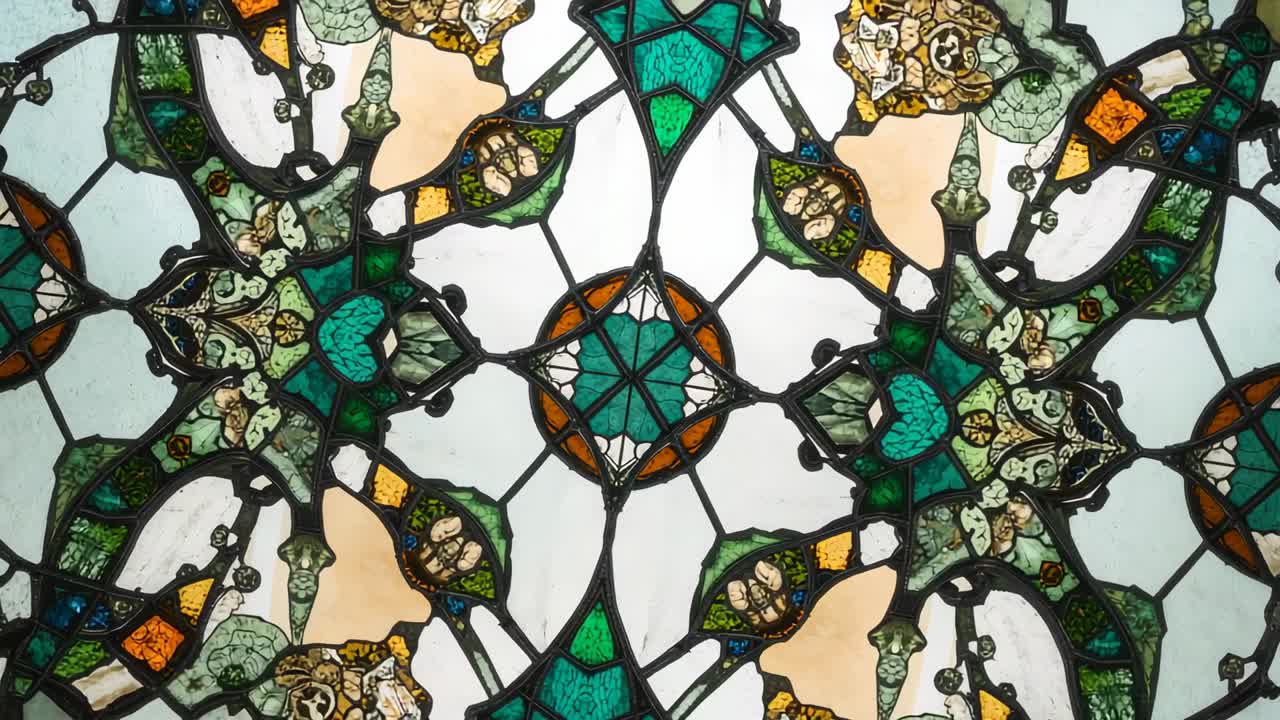 Starting rotation, camera showing stained glass in church, with multicolored glass and metal cames