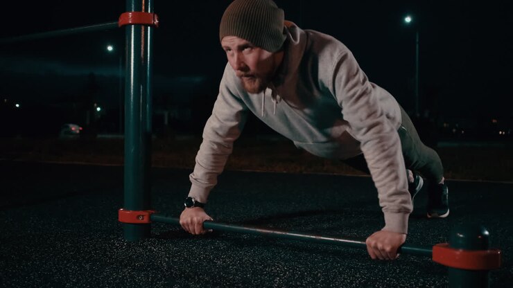 Man Doing Push-ups at Night