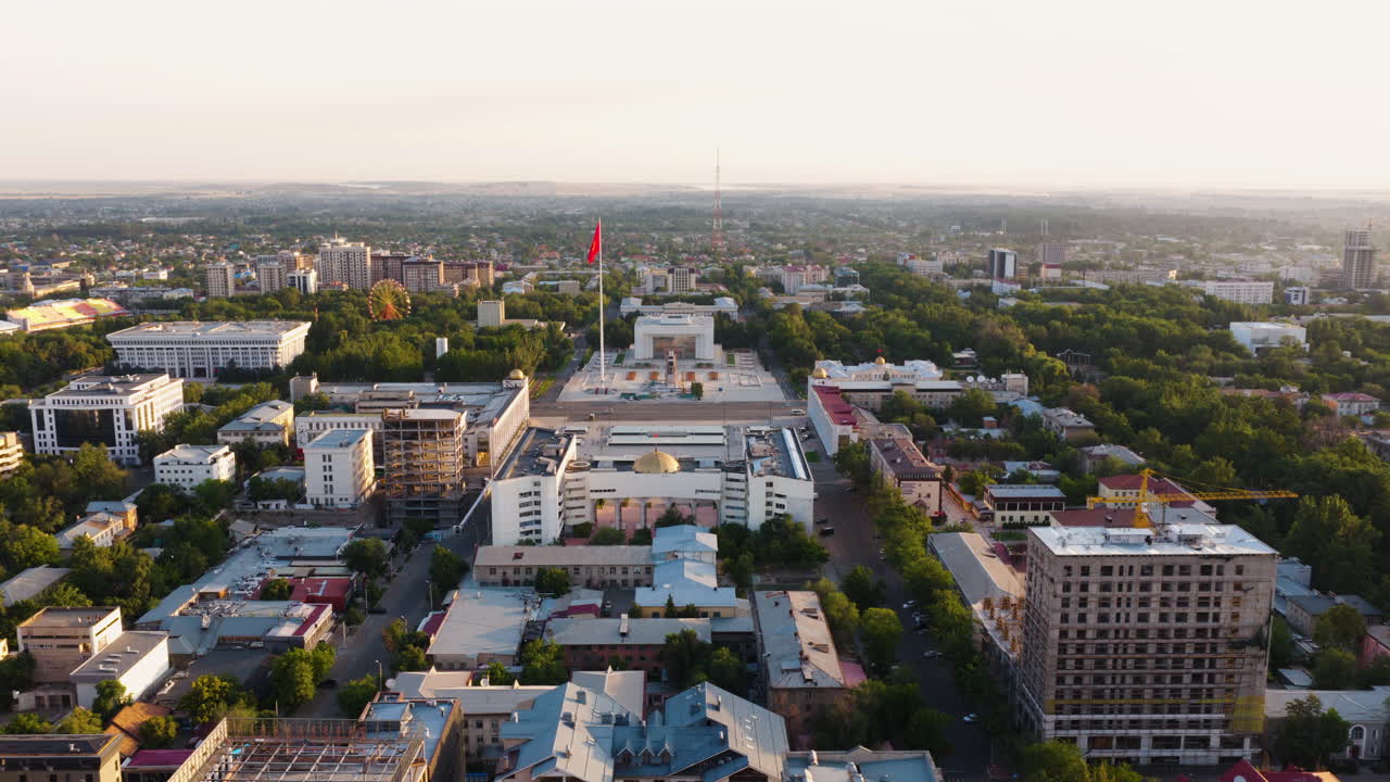Bishkek City And During Sunrise With Ala Too Square In The Distance In Kyrgyzstan. - aerial shot