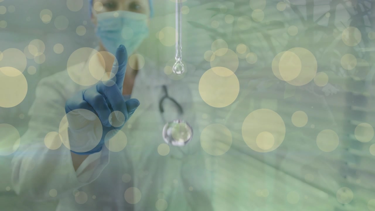 Animation of yellow dots over caucasian female doctor in face mask