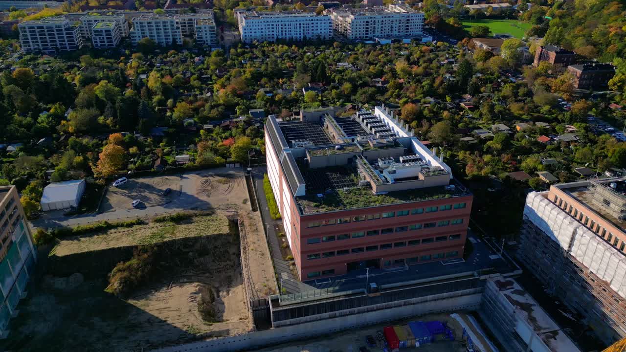biggest data center building providing cloud computing services in an urban city. blockchain digital database, internet security for sensitive data. Unique aerial view flight circle drone footage