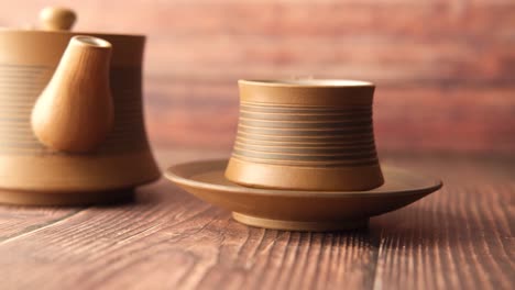 brown ceramic tea set on wooden table