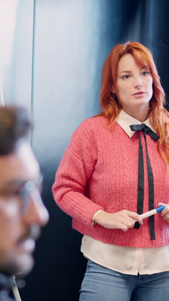 Woman clarifying an idea during a presentation in a meeting