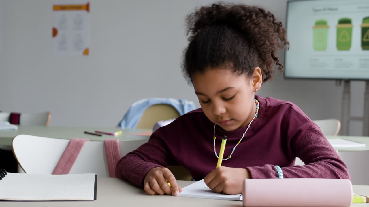 Girl Writing in Class