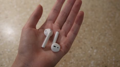 airpods in hand