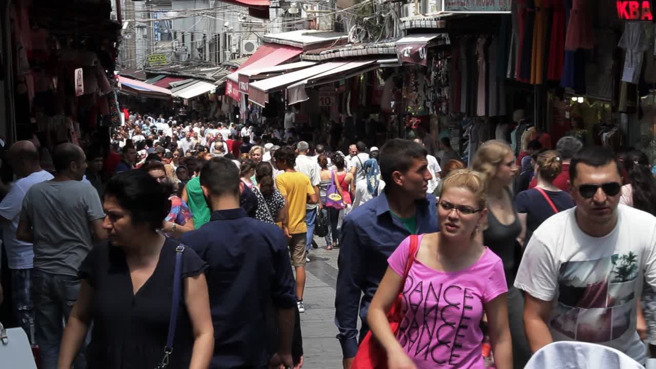 People walking in a big open air bazaar market in Istanbul, Turkey
