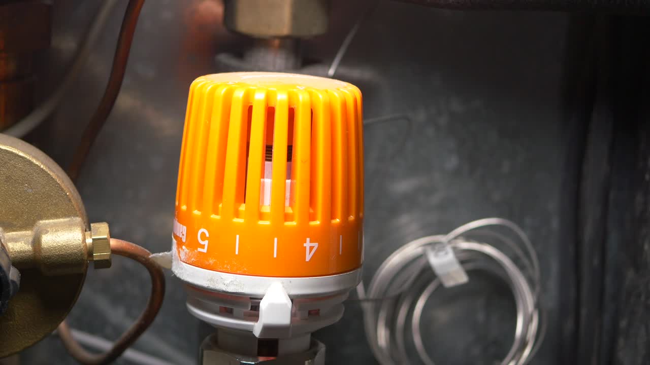 Orange Thermostat in a Heating System