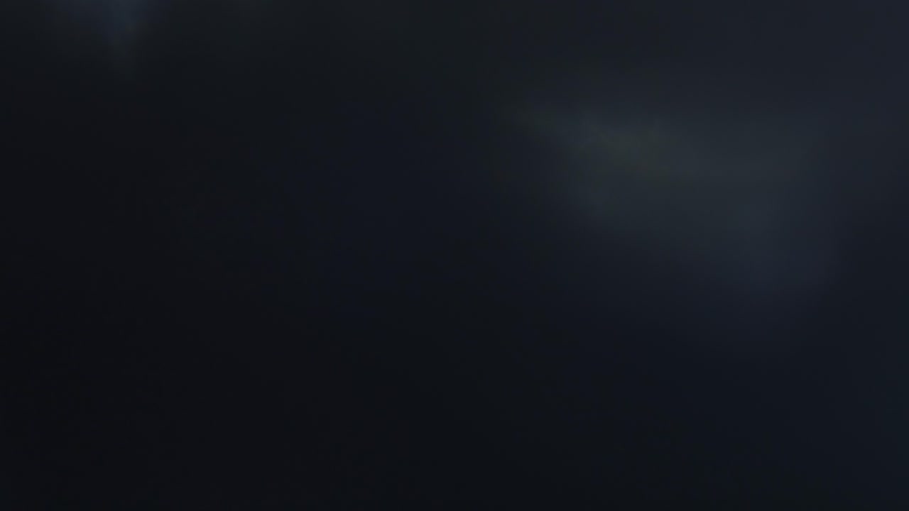 Abstract Light Leaks and Lens Flares on Dark Background