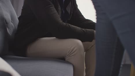 Close-Up-On-Hands-As-Couple-At-Home-Sitting-On-Sofa-In-Lounge-Having-Break-Up-Argument-1