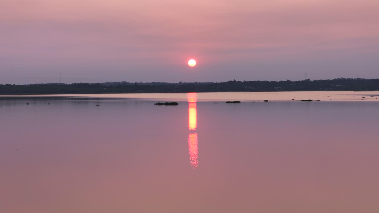 A drone's-eye view of a stunning sunset over the Paran&aacute; River