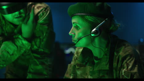 female soldier in control room