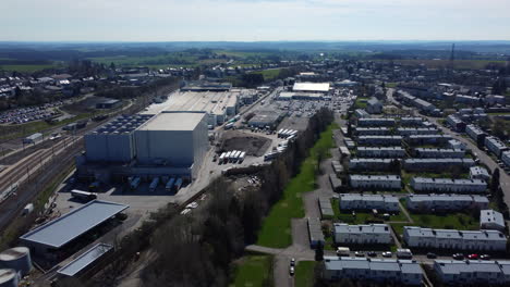 aerial view of an industrial area and residential neighborhood