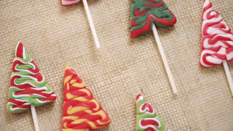 christmas tree lollipops on textile 4k