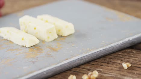 slices of cheese with grapes and walnut