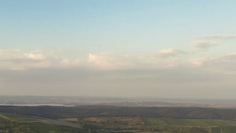 Clouds-and-dusking-haze-over-czech-countryside,-panoramic-drone-shot