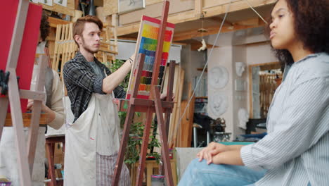 art students painting in a studio