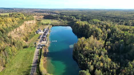 dense nature of park gródek, arboretum in jaworzno, poland. aerial drone shot